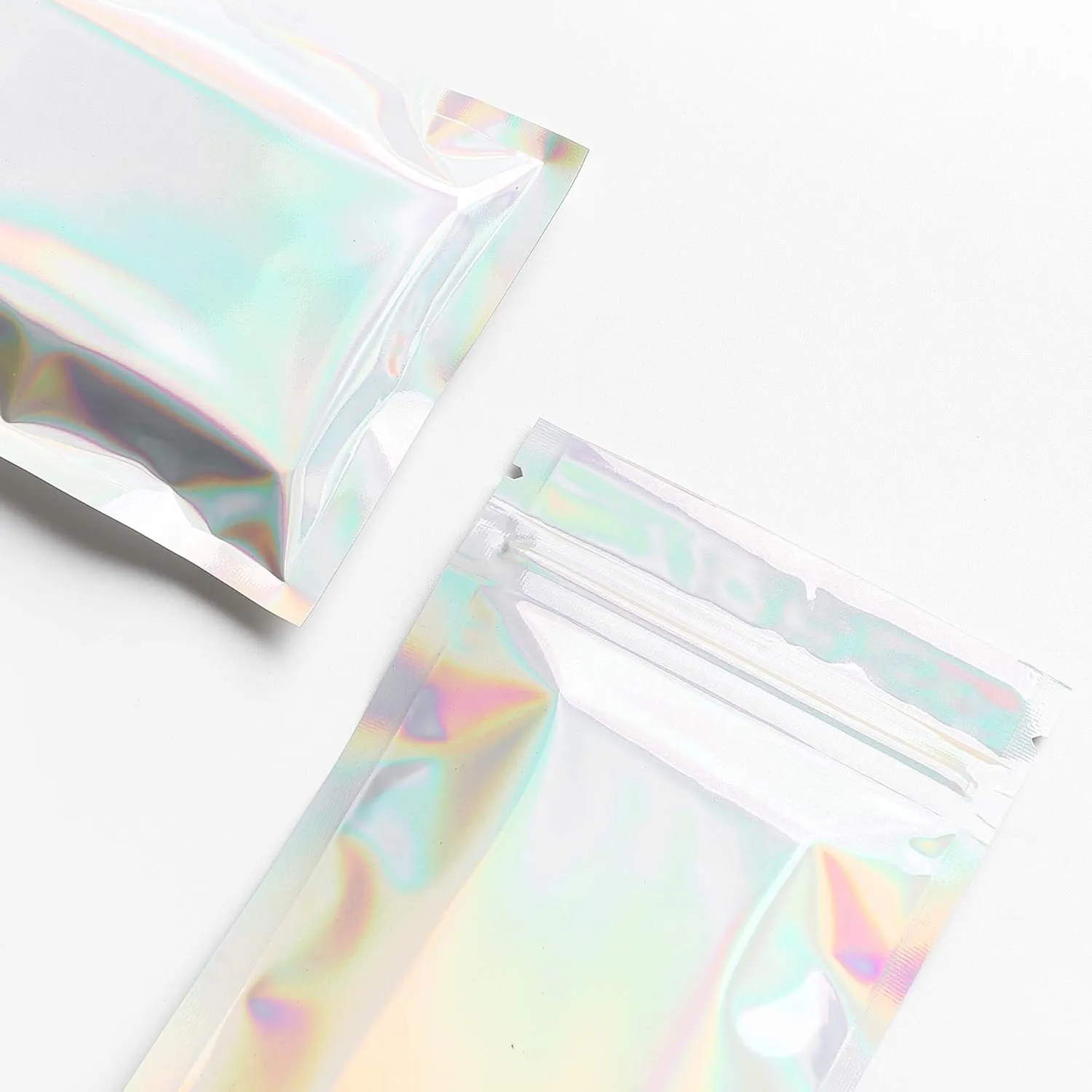 QQ Studio Pack of 100 Rainbow Holographic Double-Sided Zipper Bags for Cosmetics and Makeup (8.5x13cm (3.3x5.1"), Silver Hologram)